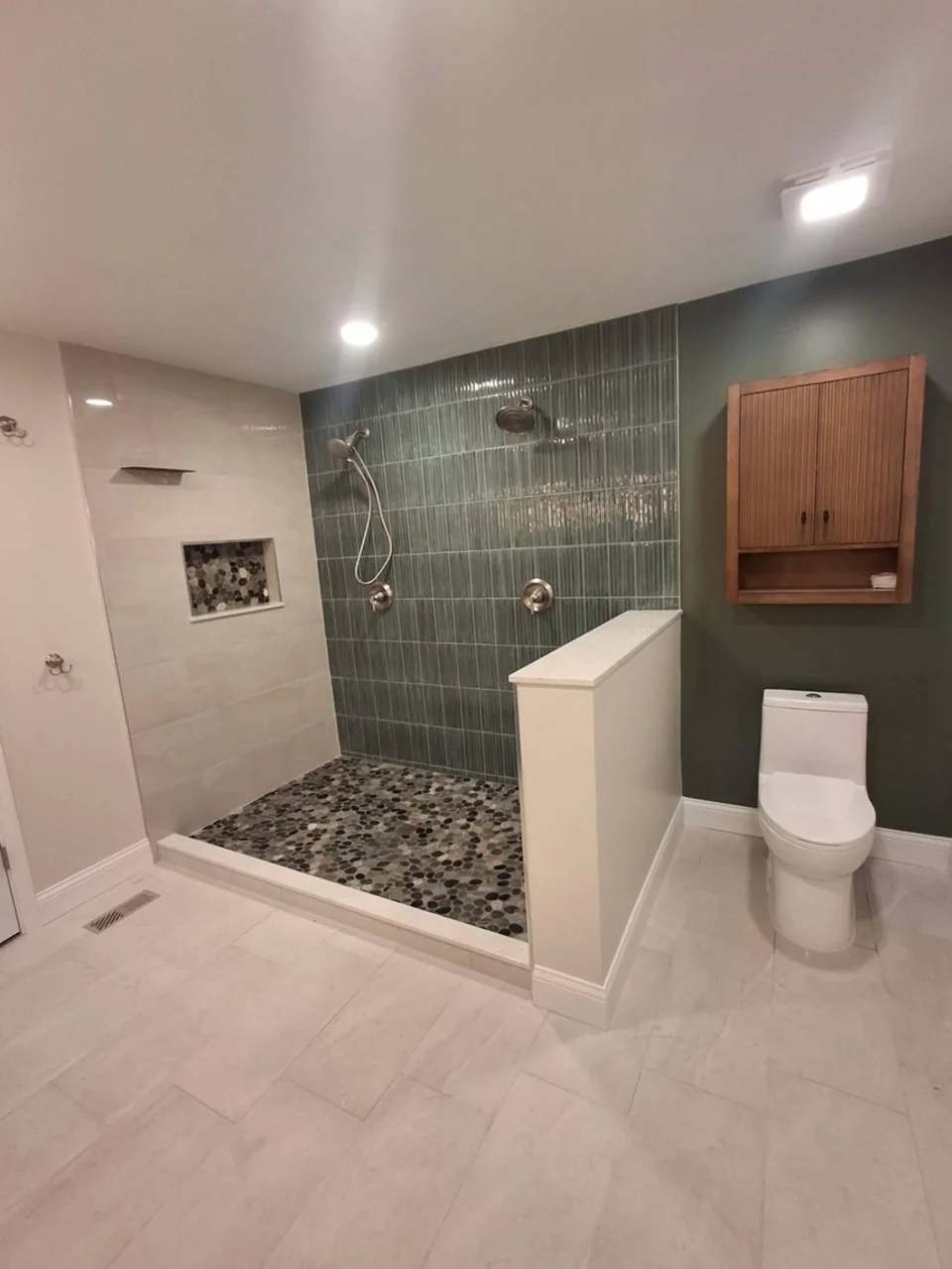 Completed tiled bathroom showing shower and vanity